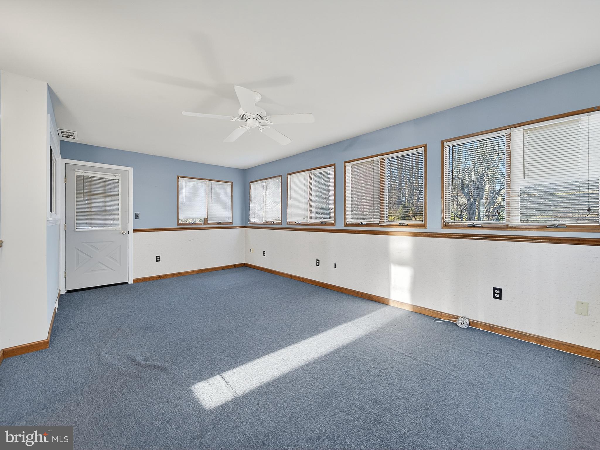 9315 Lees Ridge Road Warrenton, VA 20186 - Photo 17 of 51 wooden floor in an empty room with a window