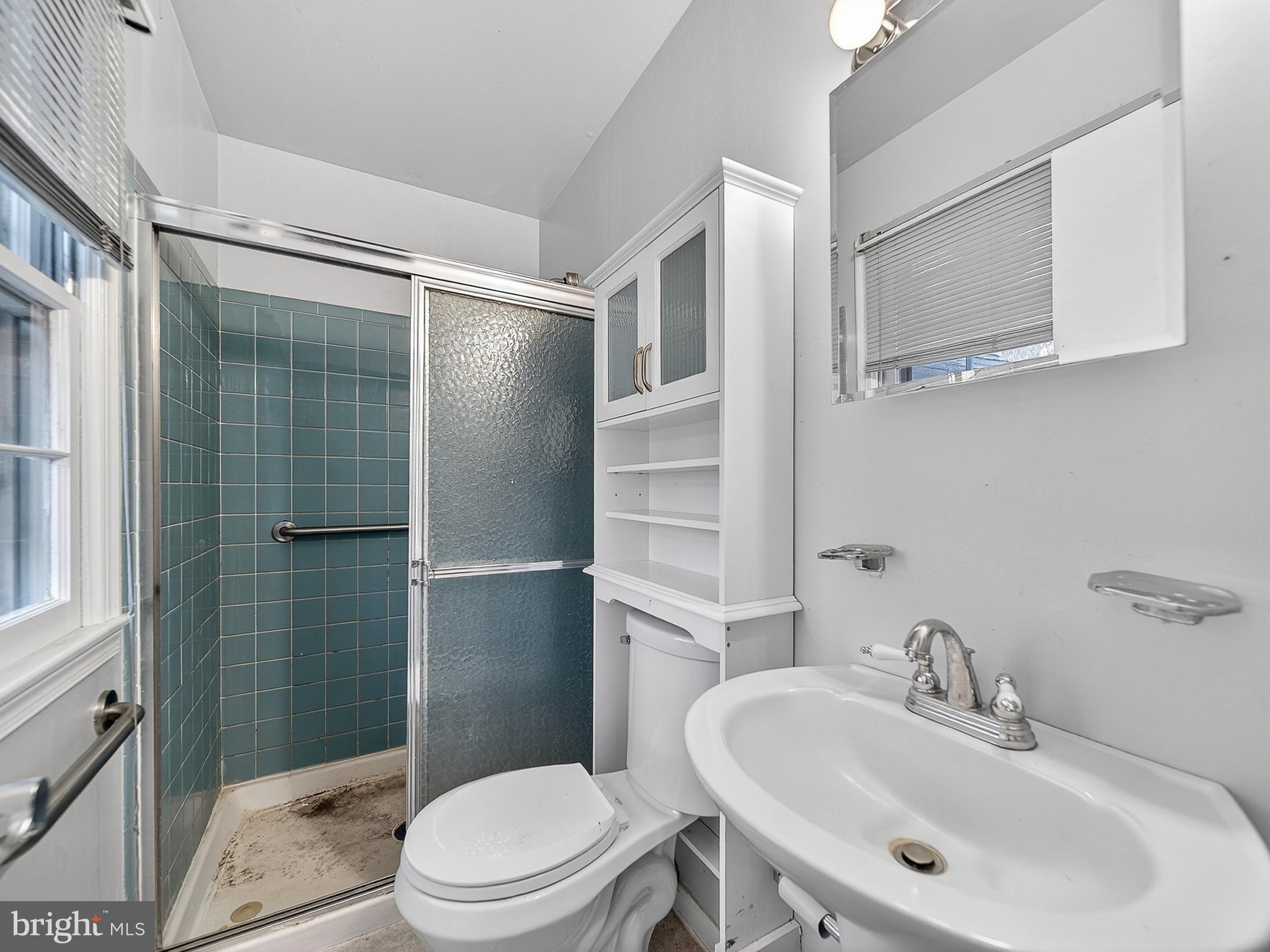 9315 Lees Ridge Road Warrenton, VA 20186 - Photo 39 of 51 a bathroom with a sink toilet and shower