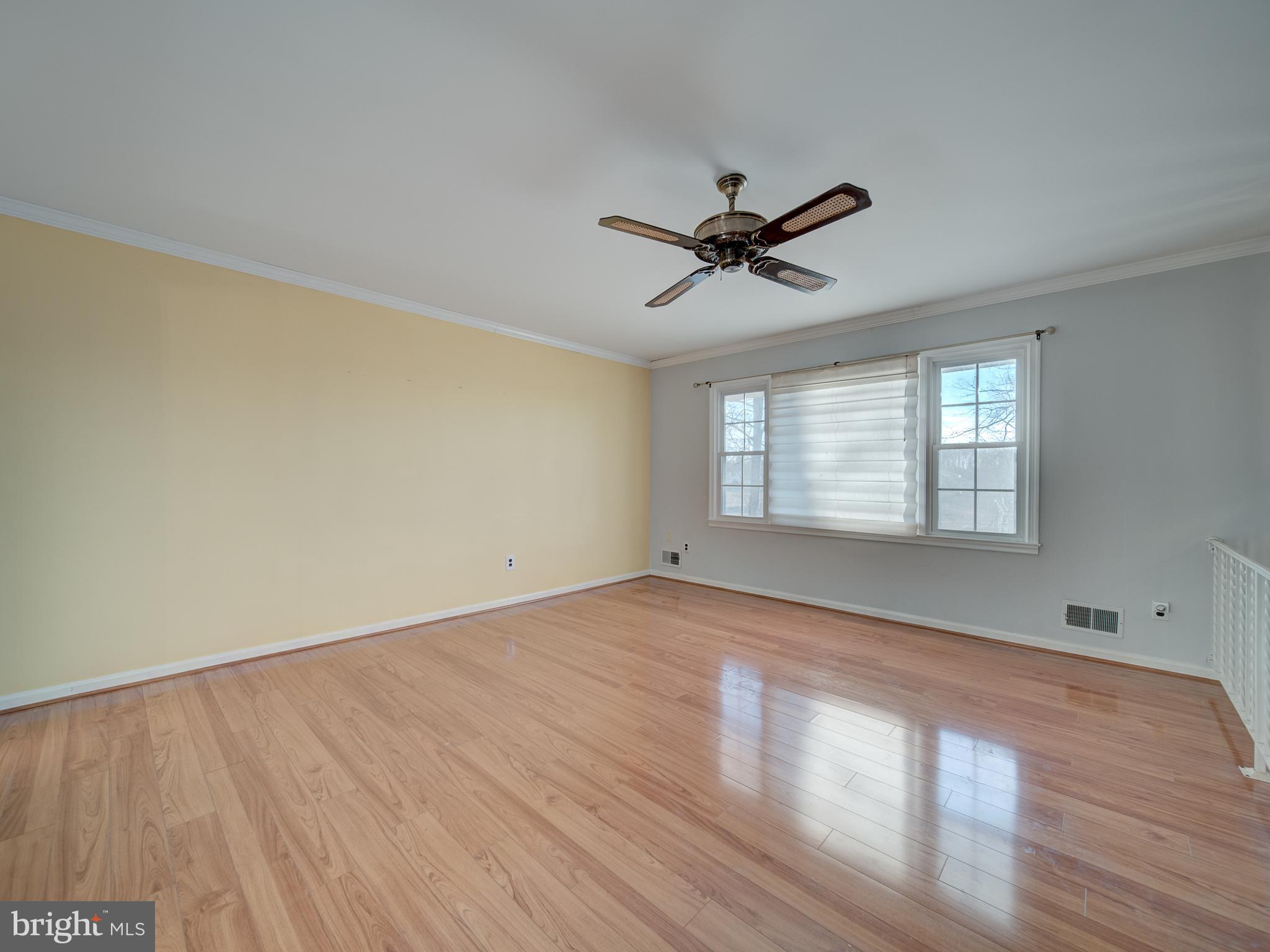 9315 Lees Ridge Road Warrenton, VA 20186 - Photo 4 of 51 a view of empty room with wooden floor and fan