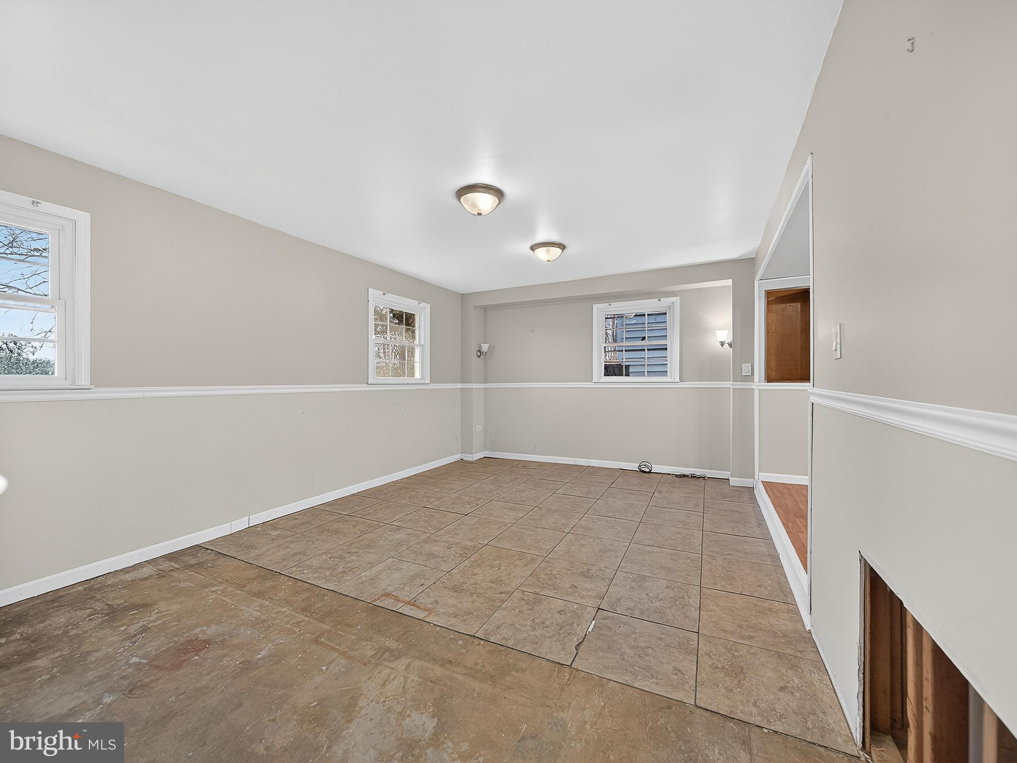 9315 Lees Ridge Road Warrenton, VA 20186 - Photo 43 of 51 a view of an empty room with wooden floor and a window