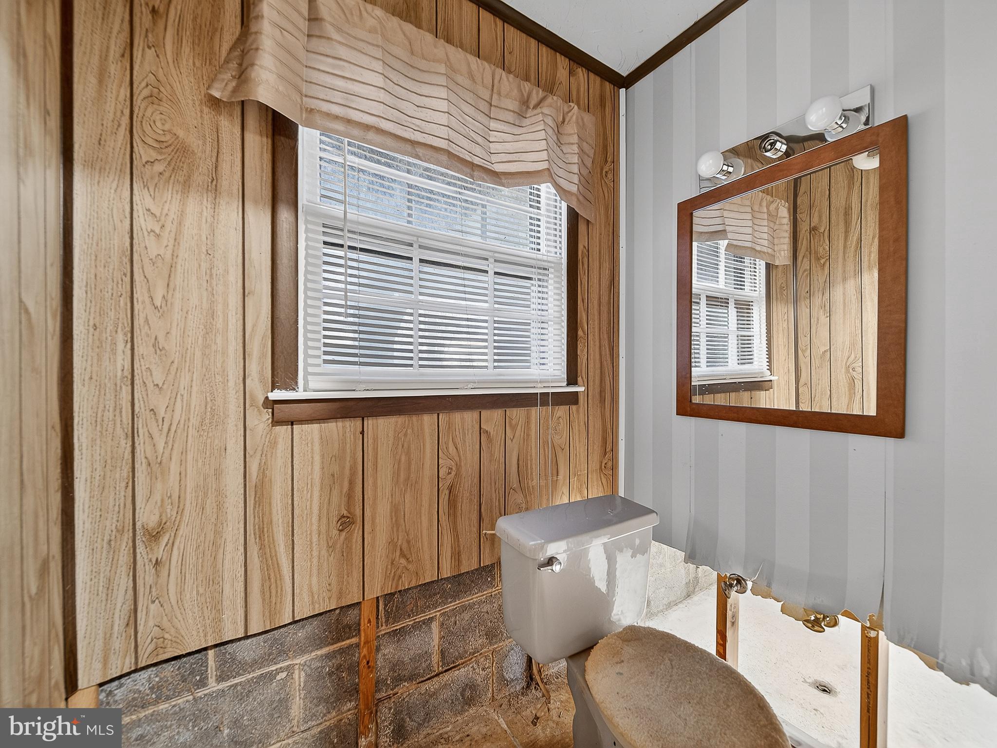 9315 Lees Ridge Road Warrenton, VA 20186 - Photo 47 of 51 a view of a room that has a bench and chair