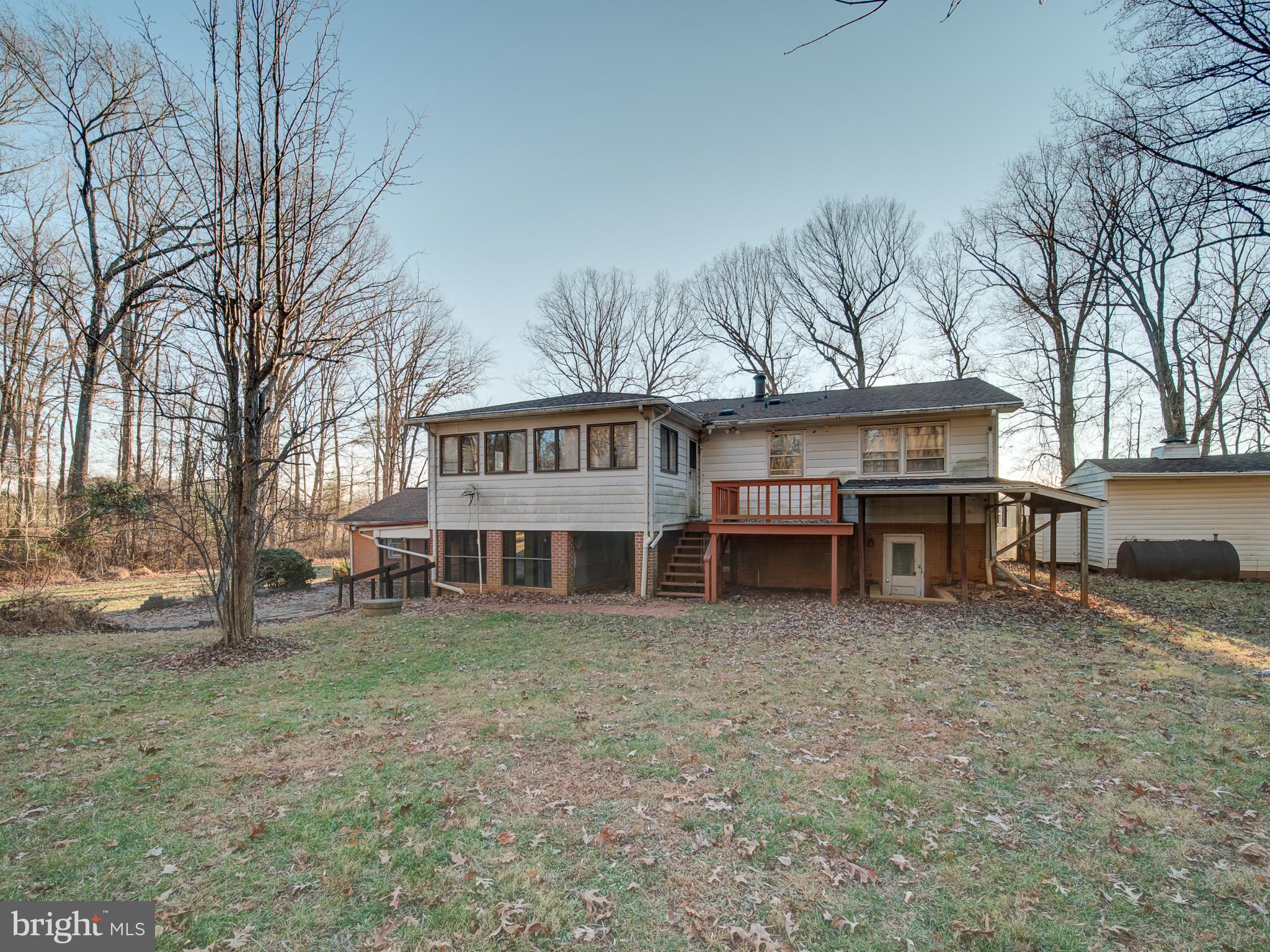 9315 Lees Ridge Road Warrenton, VA 20186 - Photo 50 of 51 front view of a house with a big yard and large trees