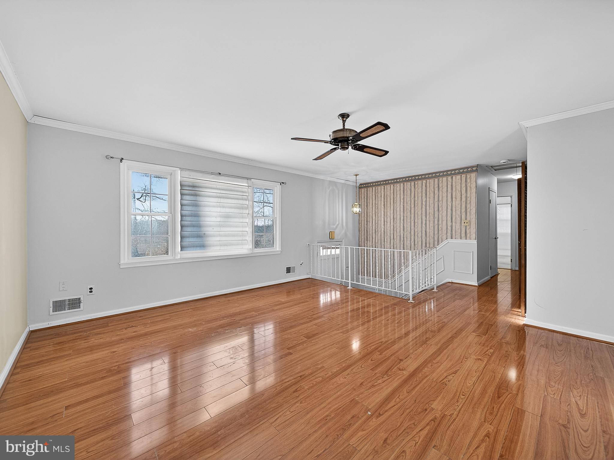9315 Lees Ridge Road Warrenton, VA 20186 - Photo 7 of 51 a view of empty room with wooden floor and fan