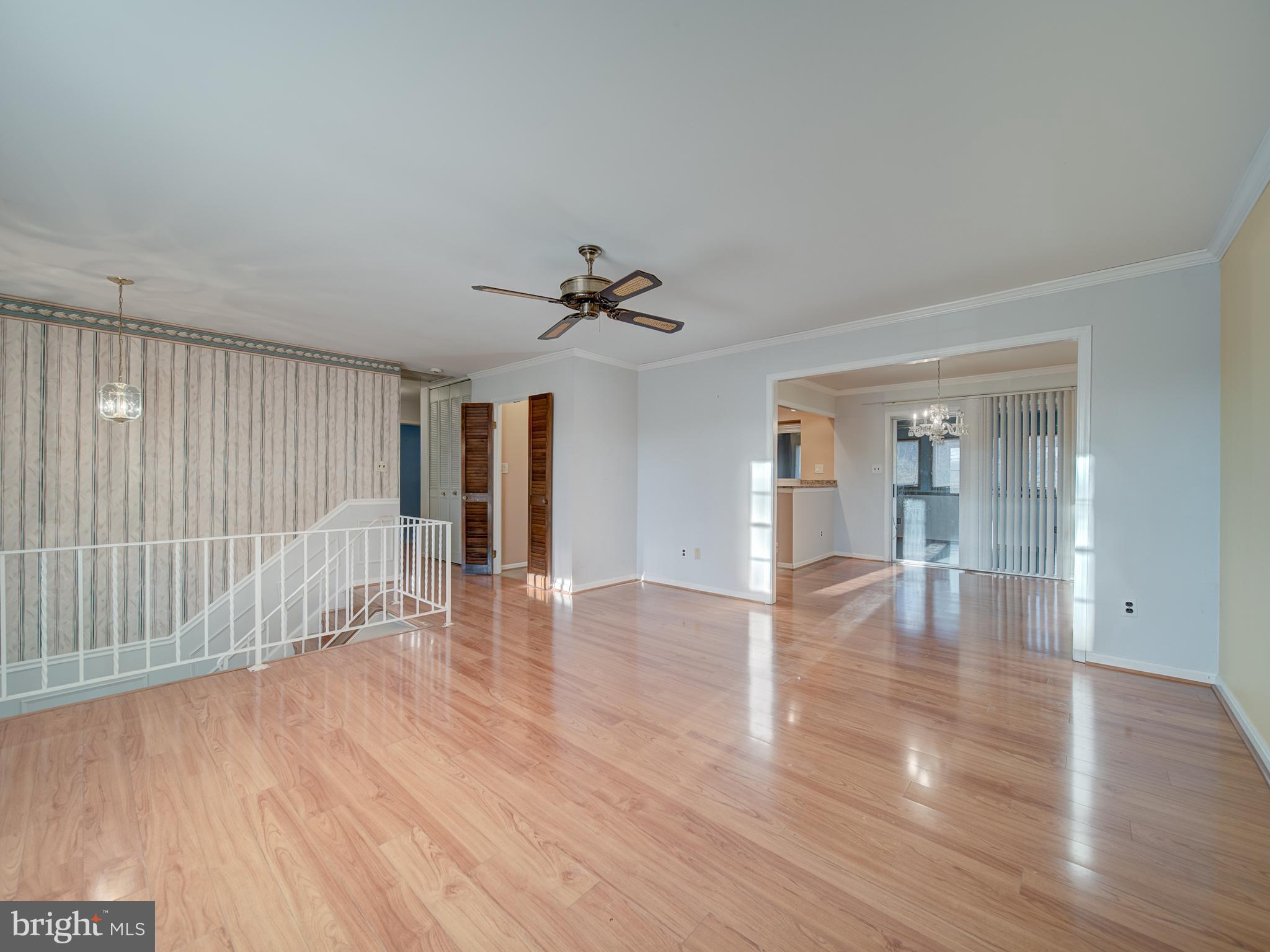 9315 Lees Ridge Road Warrenton, VA 20186 - Photo 8 of 51 a view of empty room with wooden floor and fan