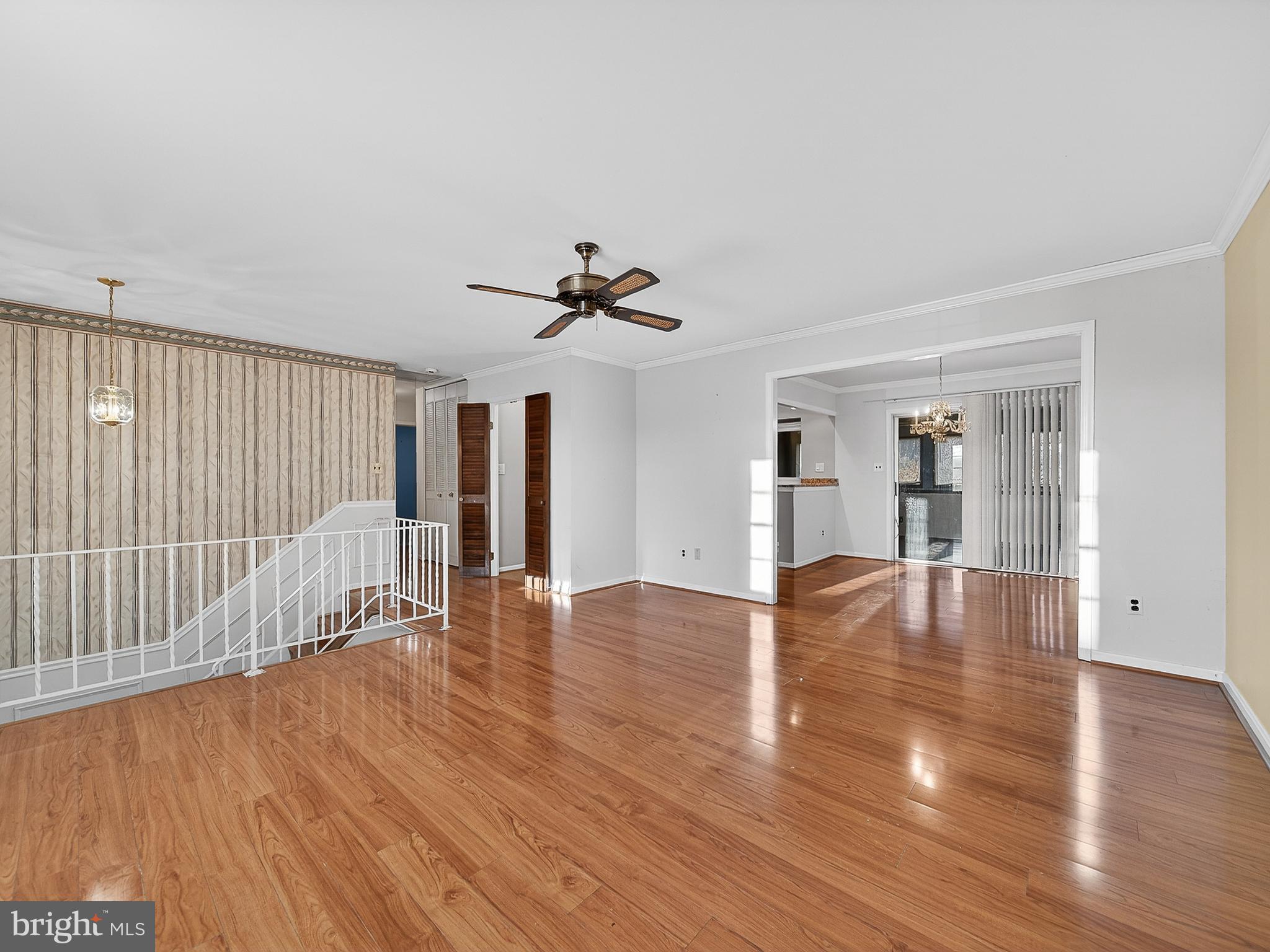 9315 Lees Ridge Road Warrenton, VA 20186 - Photo 9 of 51 a view of empty room with wooden floor and fan