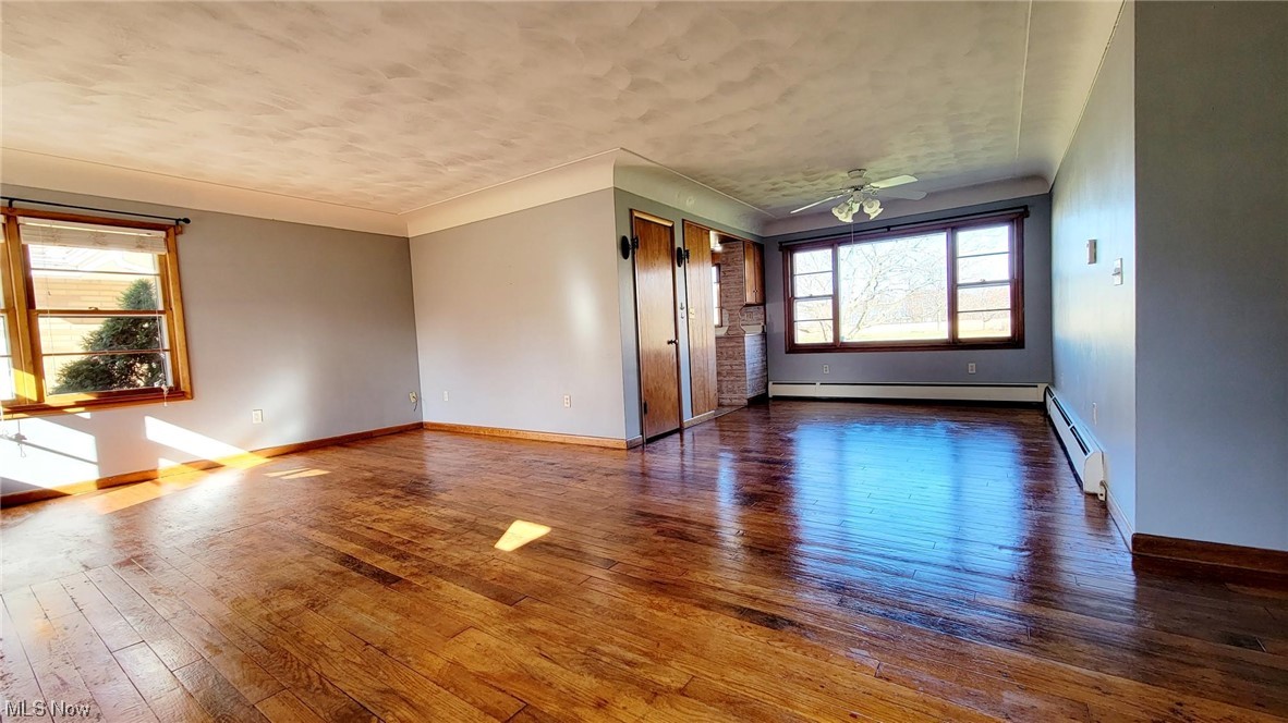 405 Bryan Road Milan, OH 44846 - Photo 7 of 35 Living & Dining area with hardwood floor