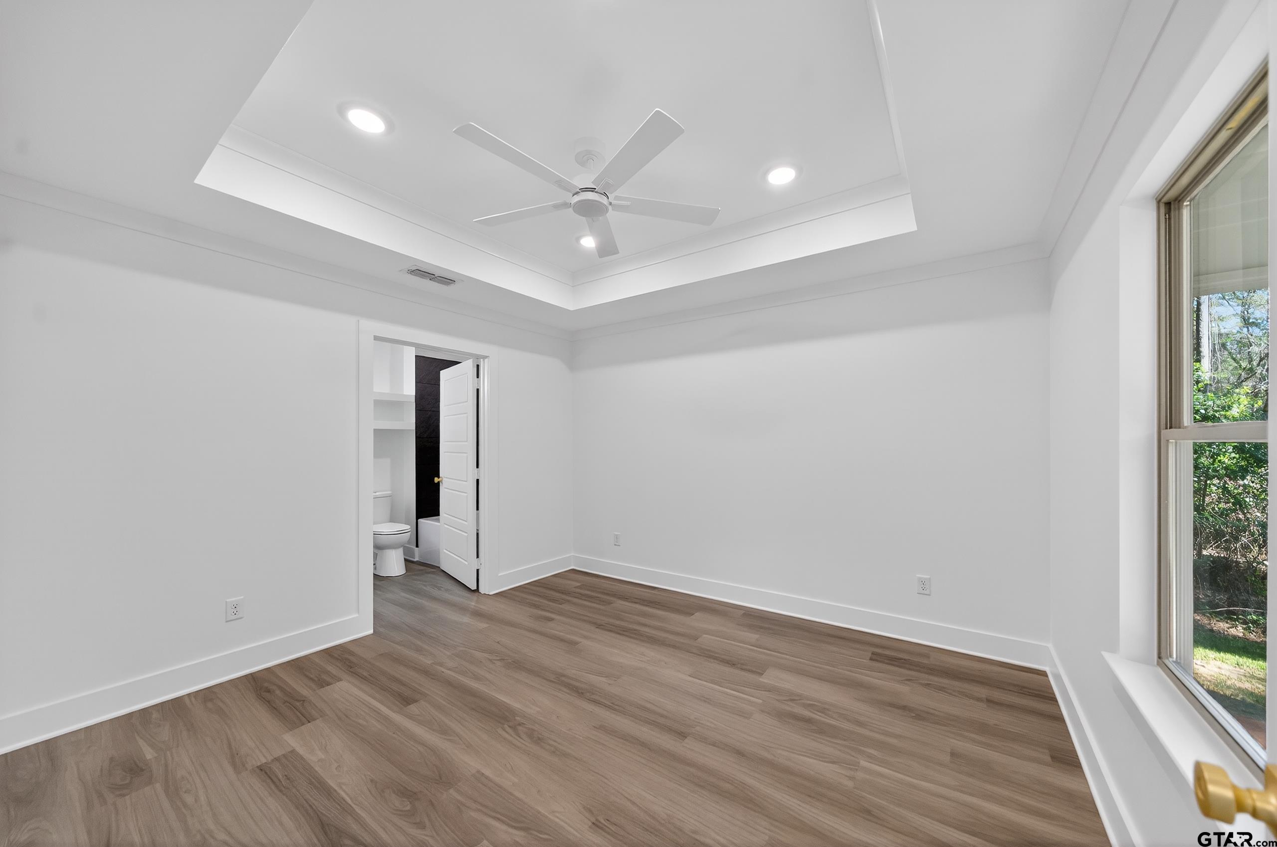 329 Wiley Drive Bullard, TX 75757 - Photo 19 of 31 an empty room with wooden floor and windows