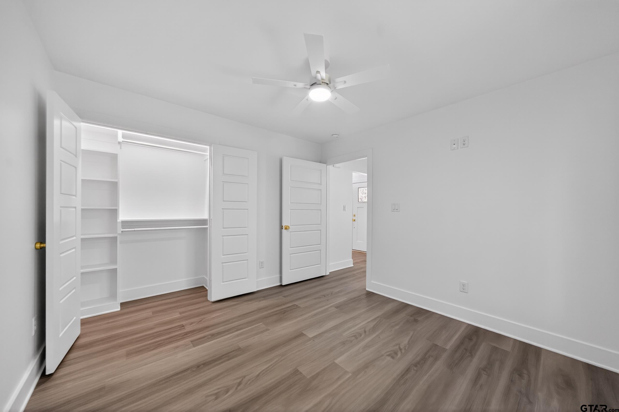 329 Wiley Drive Bullard, TX 75757 - Photo 26 of 31 a view of an empty room with wooden floor