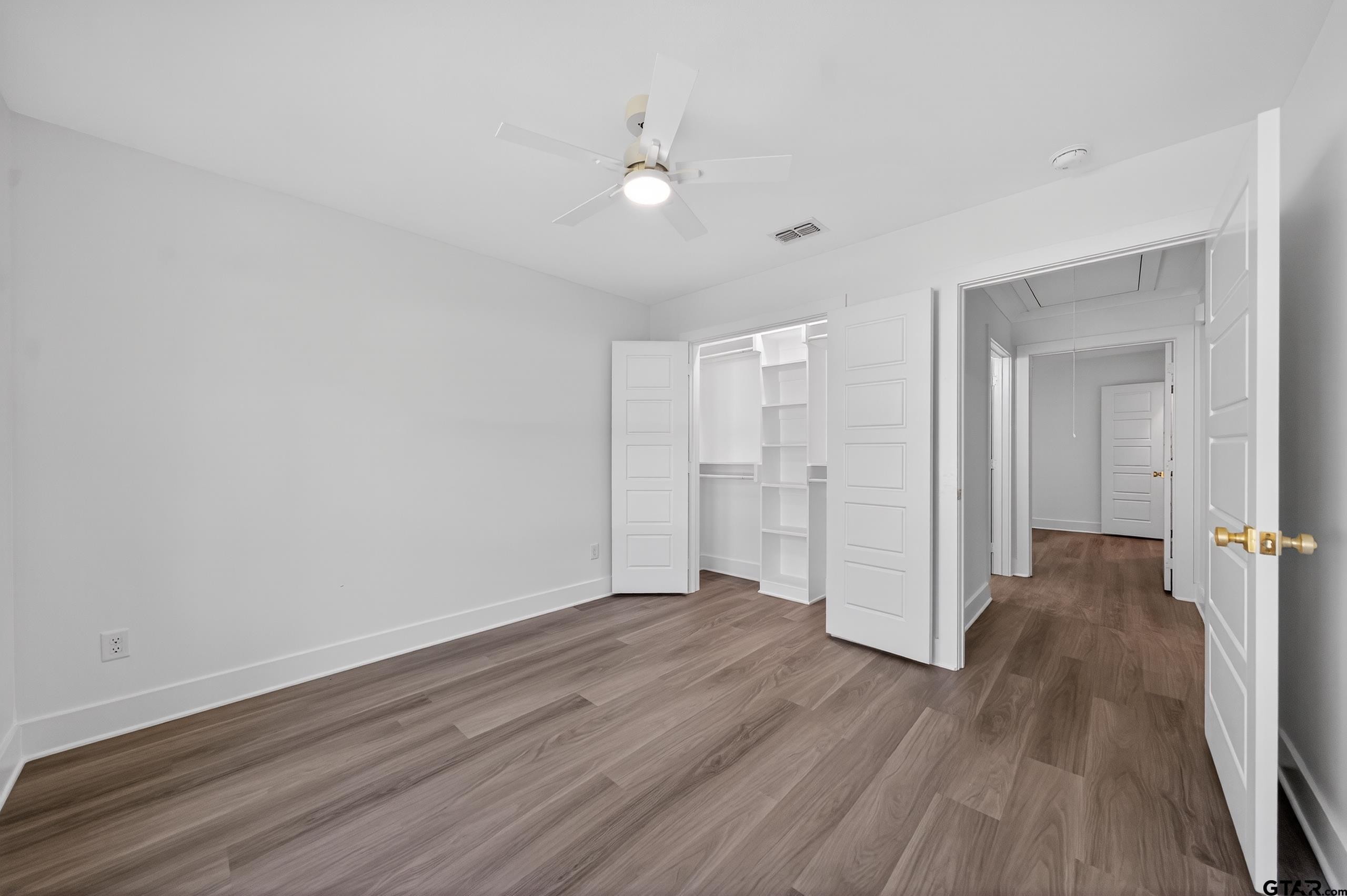 329 Wiley Drive Bullard, TX 75757 - Photo 30 of 31 a view of a big room with wooden floor and closet