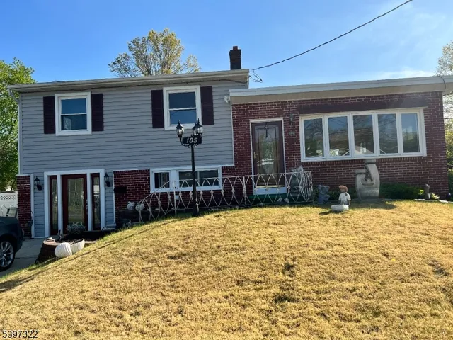 a view of house with yard