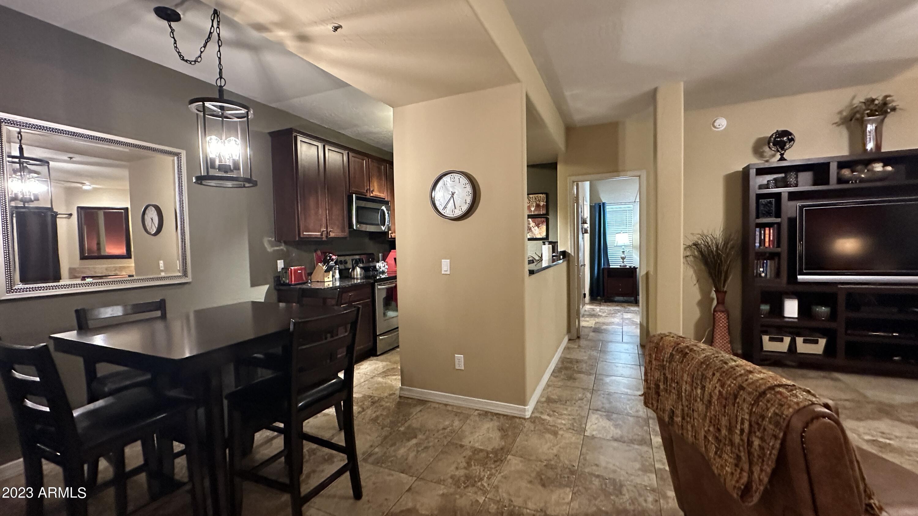 14145 North 92nd Street, Unit 1027 Scottsdale, AZ 85260 - Photo 10 of 30 Dining to Primary and Living Room