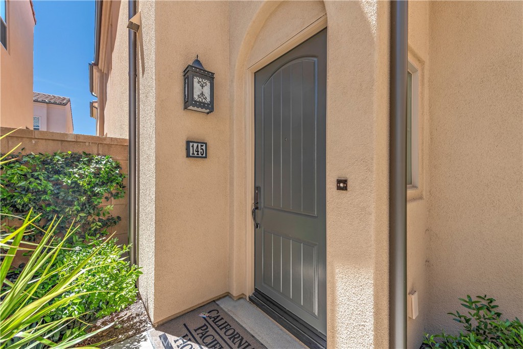 145 Messenger Irvine, CA 92618 - Photo 1 of 1 a view of a door and a yard from a corridor