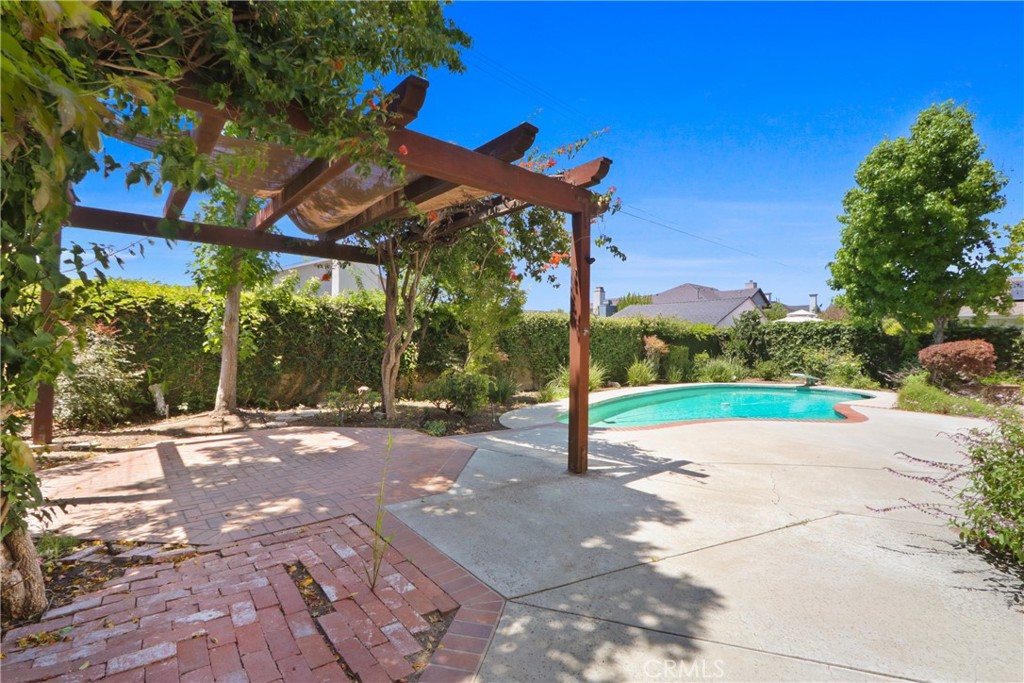 3142 Quail Run Road Rossmoor, CA 90720 - Photo 31 of 35 Enjoy relaxing or entertaining in the beautiful backyard with pool