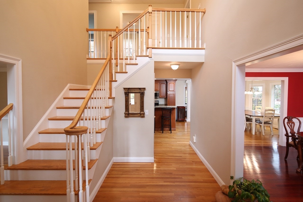 375 Webster Street Hanover, MA 02339 - Photo 4 of 24 a view of entryway and hall with wooden floor