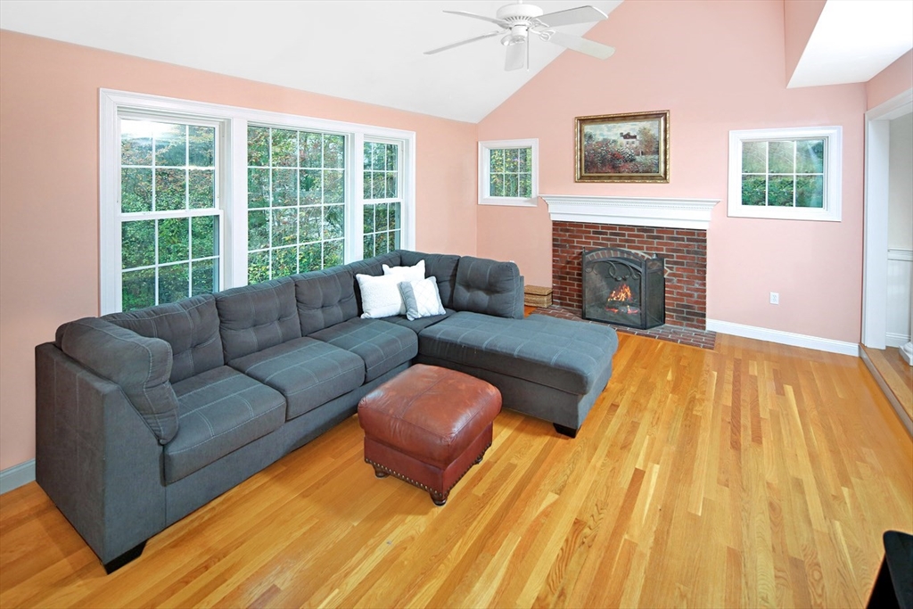 375 Webster Street Hanover, MA 02339 - Photo 9 of 24 a living room with furniture and a fireplace