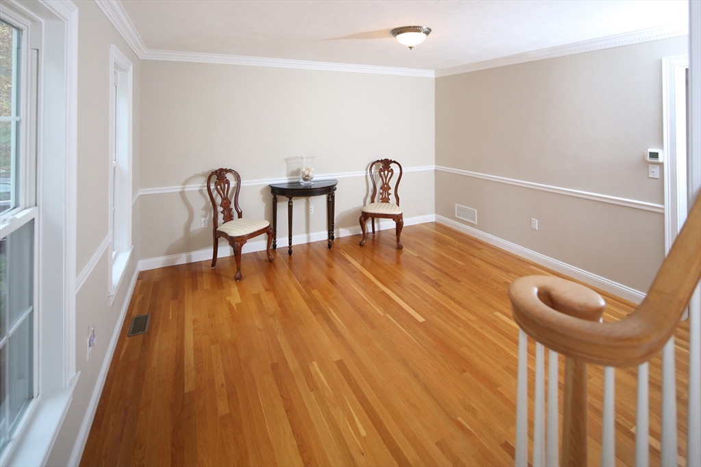 375 Webster Street Hanover, MA 02339 - Photo 10 of 24 a view of a room with wooden floor and chair