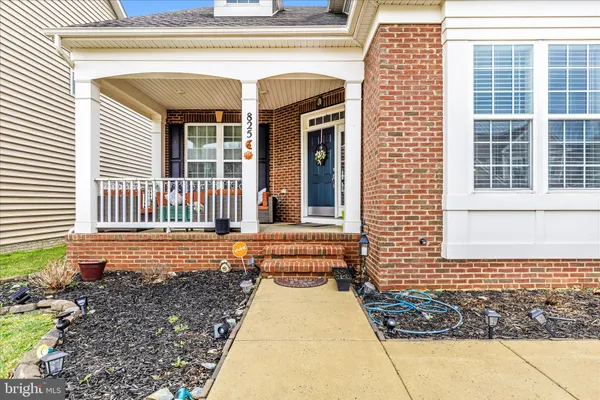 a view of a brick house with many windows
