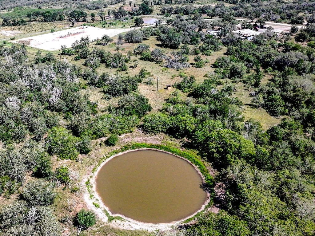 502 Robertson Road Smiley, TX 78159 - Photo 6 of 27 an aerial view of a house with a yard and lake view