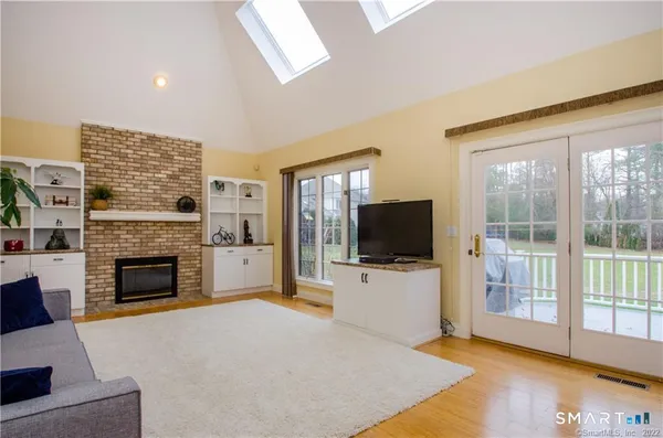 a view of a livingroom with furniture and a flat screen tv