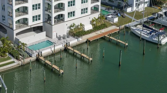 a view of residential houses with outdoor space and lake view