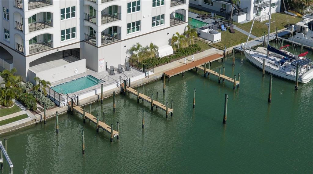 211 Dolphin Point, Unit 5 Clearwater Beach, FL 33767 - Photo 5 of 16 a view of residential houses with outdoor space and lake view
