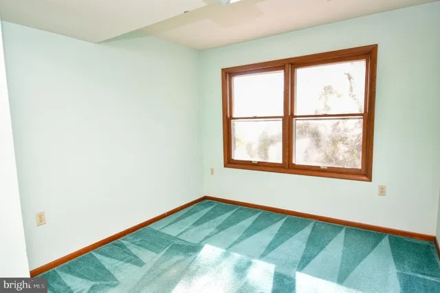 a white toilet sitting next to a bathroom