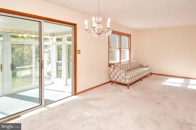 a spacious bedroom with a bed and a couch