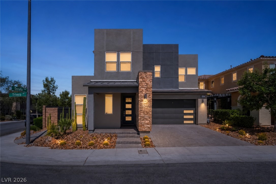 2166 Trivero Street Henderson, NV 89044 - Photo 46 of 61 Modern desert architecture is showcased in this home's clean lines and striking stacked stone accent.