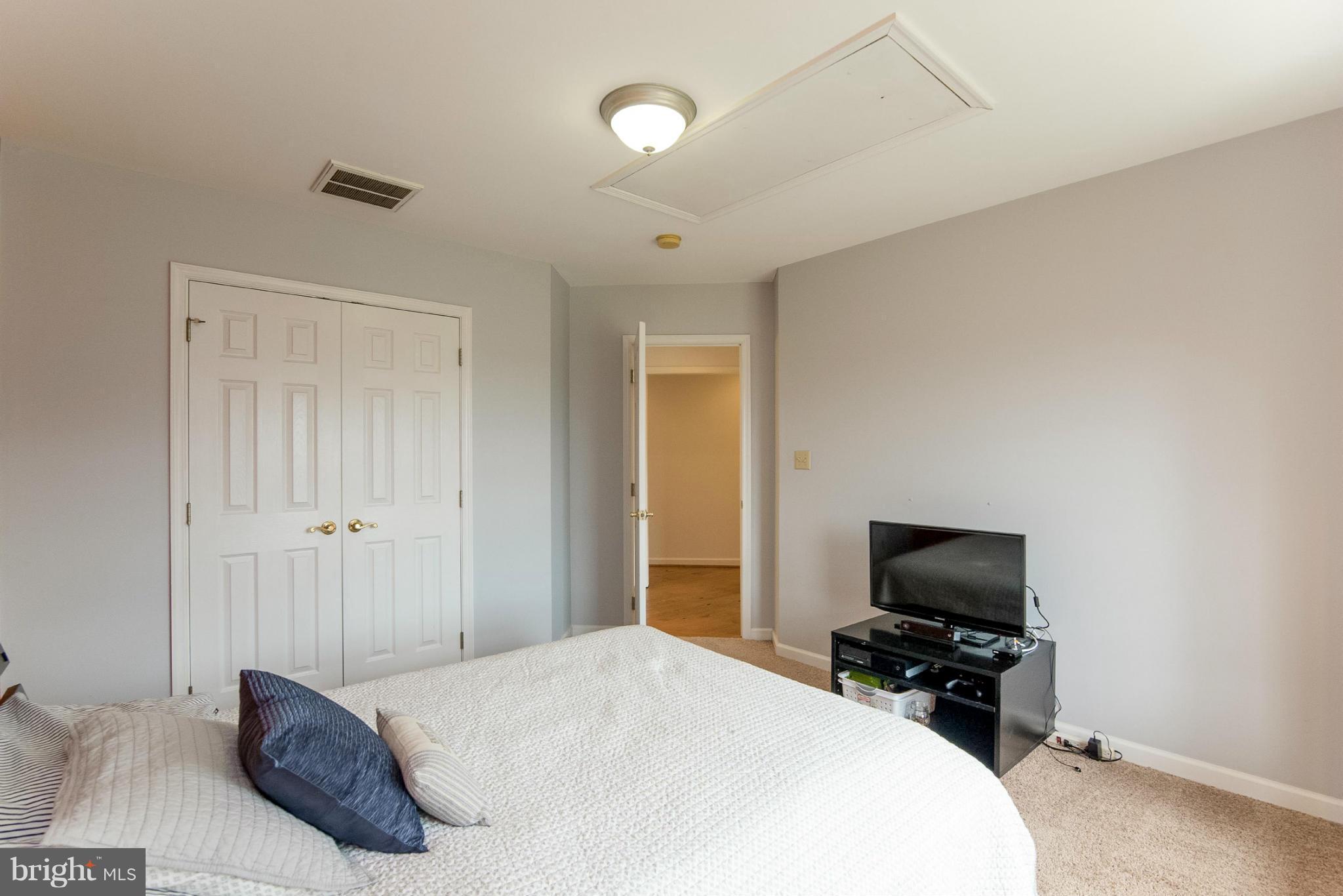 2501 Braddock Road Mount Airy, MD 21771 - Photo 13 of 30 a bedroom with a bed and a flat screen tv