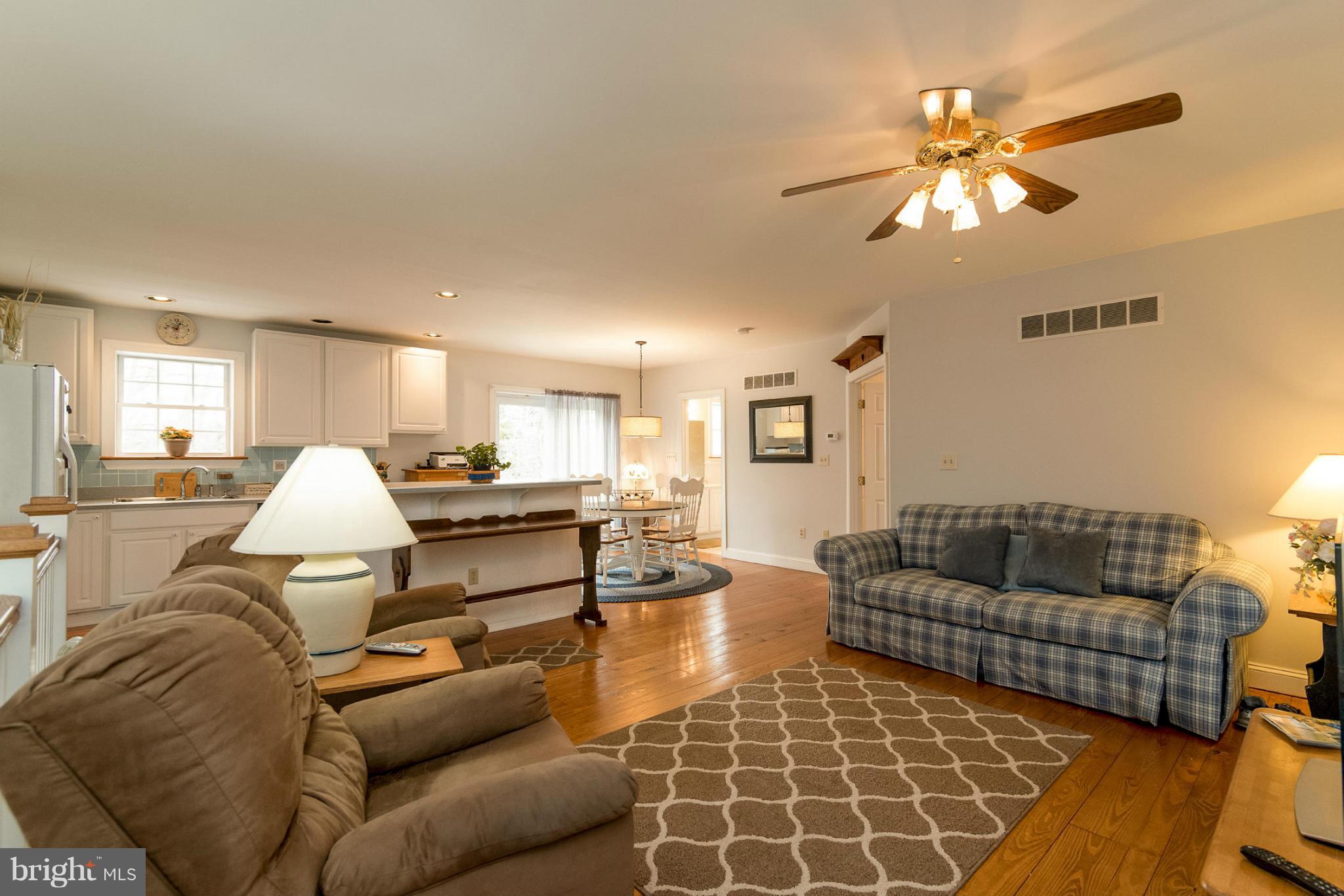 2501 Braddock Road Mount Airy, MD 21771 - Photo 23 of 30 a living room with furniture and a chandelier