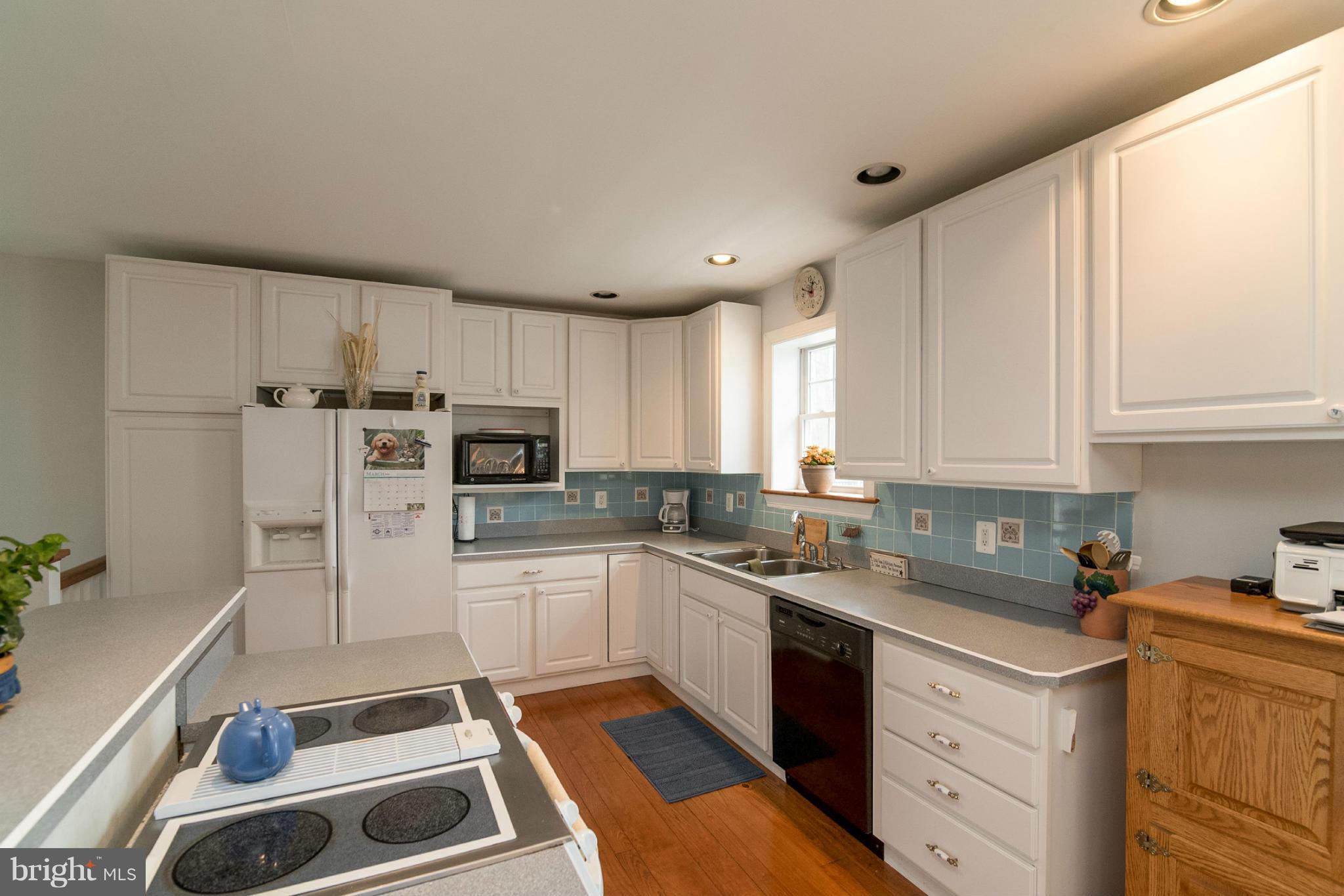 2501 Braddock Road Mount Airy, MD 21771 - Photo 24 of 30 a kitchen with stainless steel appliances a stove a sink a refrigerator and cabinets