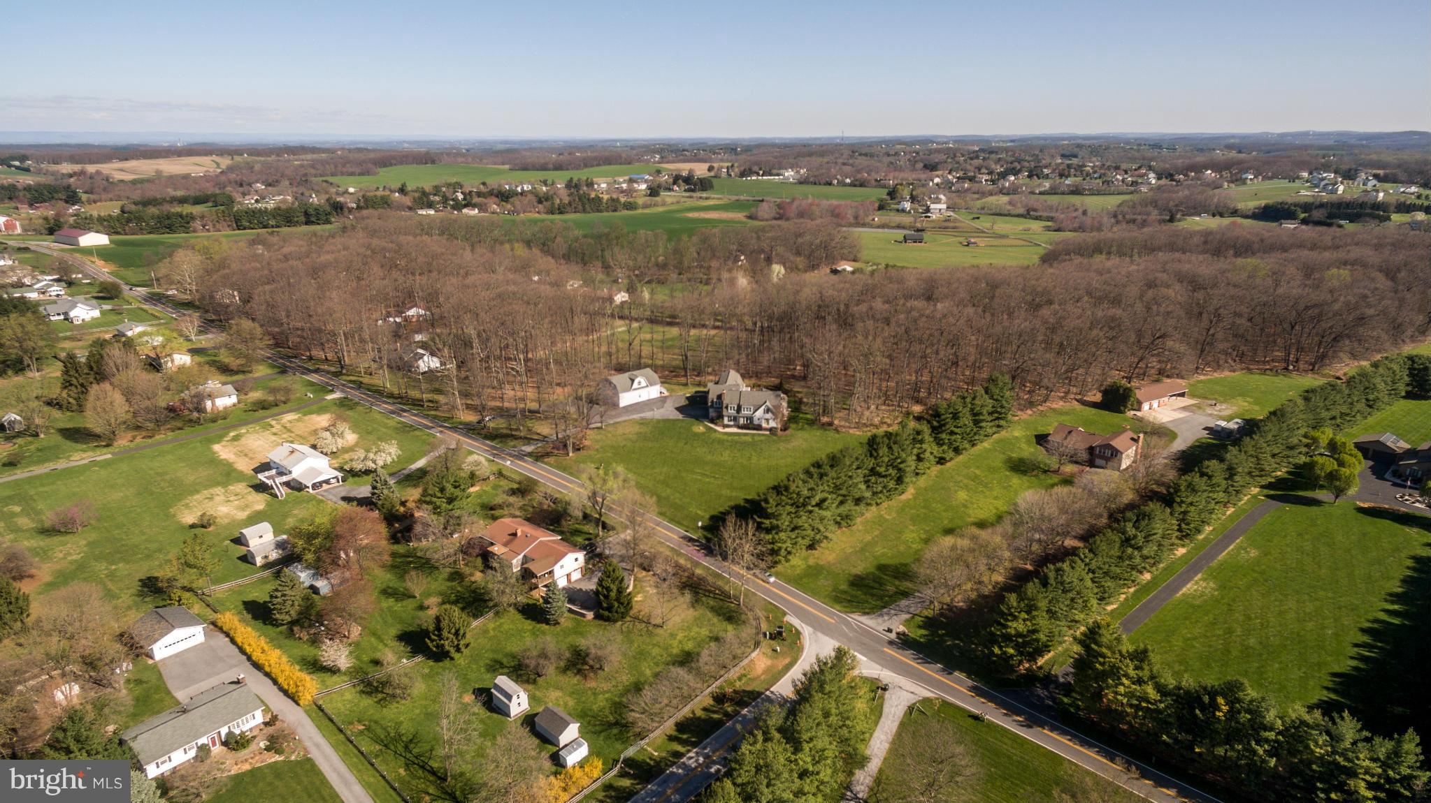 2501 Braddock Road Mount Airy, MD 21771 - Photo 30 of 30 an aerial view of a city with lots of residential buildings and lake view