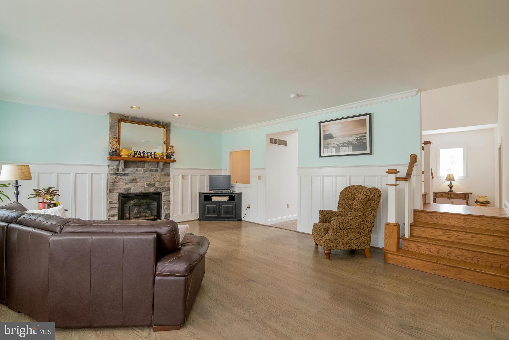 2501 Braddock Road Mount Airy, MD 21771 - Photo 5 of 30 a living room with furniture and a fireplace