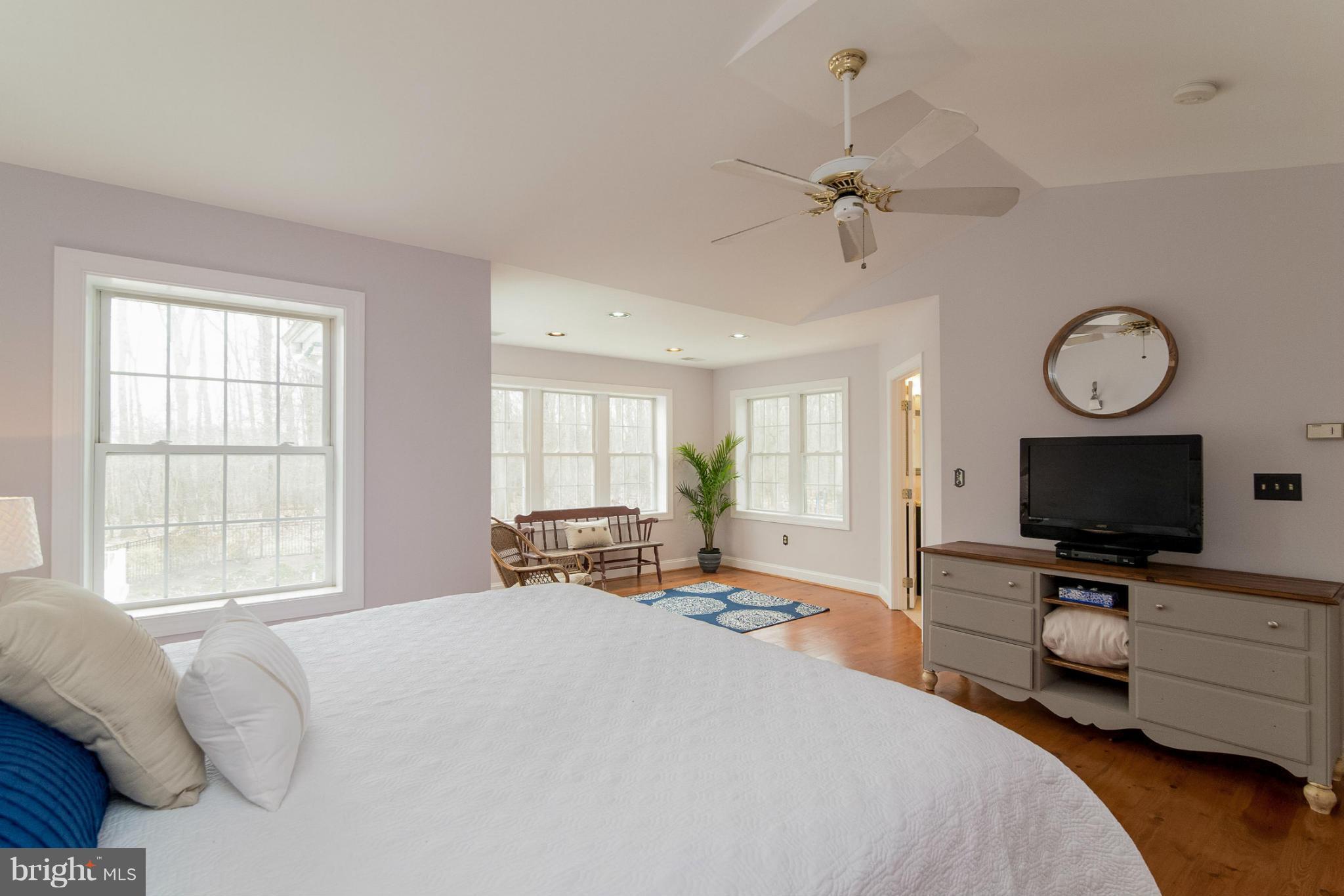2501 Braddock Road Mount Airy, MD 21771 - Photo 7 of 30 a bedroom with a bed and a flat tv screen on the dresser