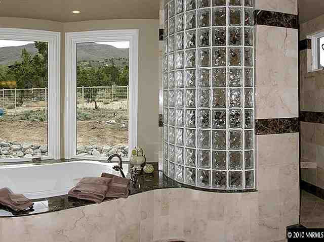 4189 Plateau Court Reno, NV 89519 - Photo 8 of 9 a view of a livingroom with wooden floor and a large window