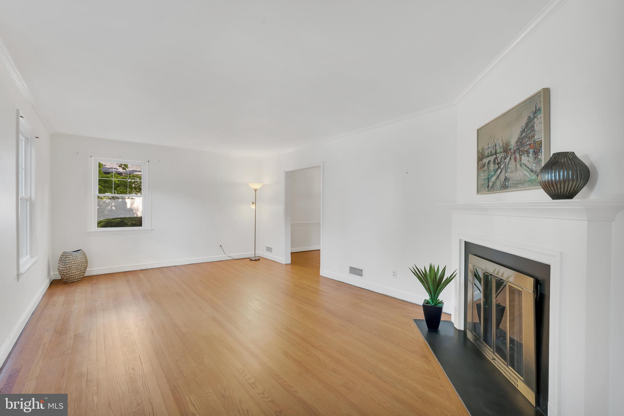 5523 Trent Street Chevy Chase, MD 20815 - Photo 2 of 42 Sun-Filled Living Room with a Fireplace