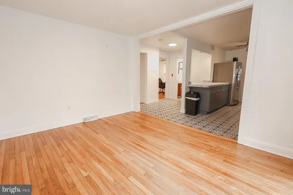 a bedroom with a bed and a dresser in it