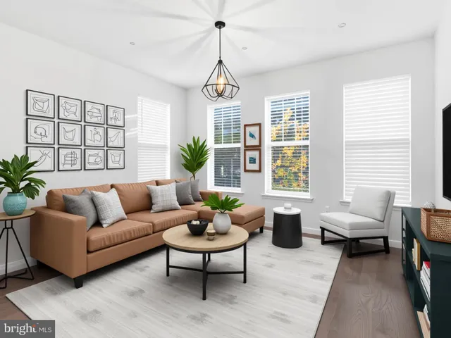 a living room with furniture and windows