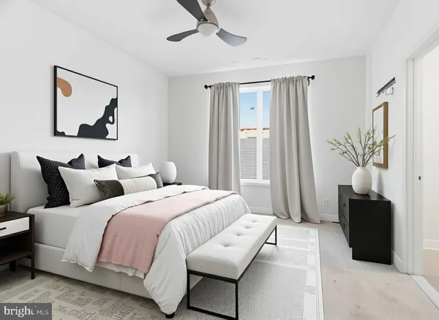 a bedroom with bed and a couch