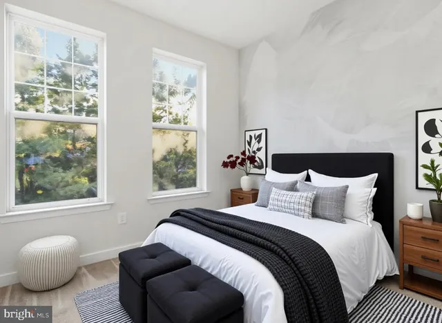 a bedroom with a bed and window