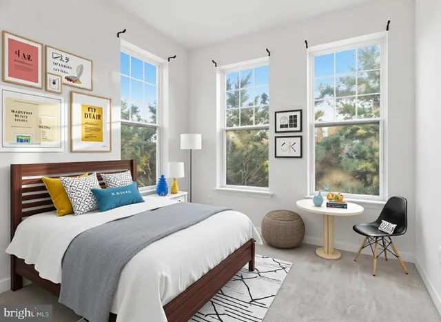 a bedroom with a bed and a table