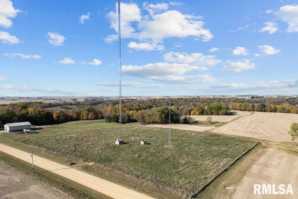 a view of a swimming pool with a yard