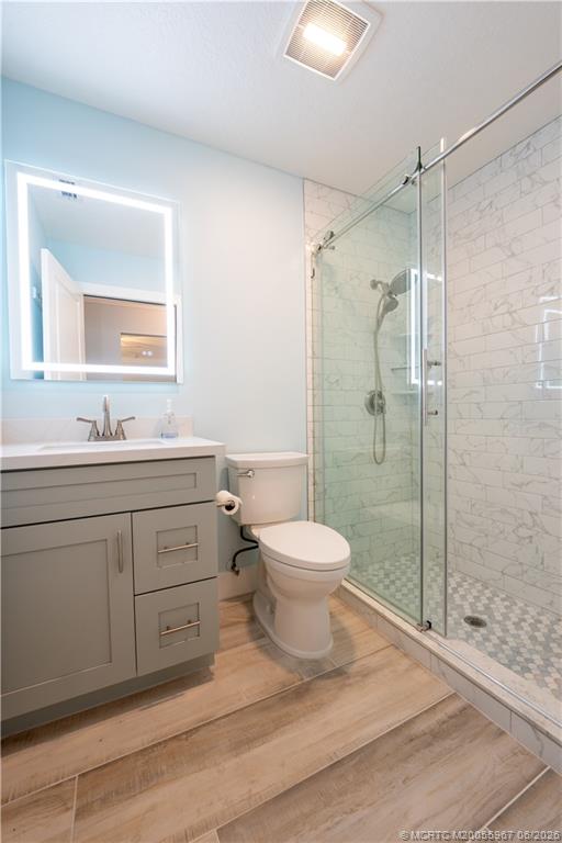 8200 Southwest Springhaven Avenue Indiantown, FL 34956 - Photo 31 of 35 a bathroom with a sink toilet and shower