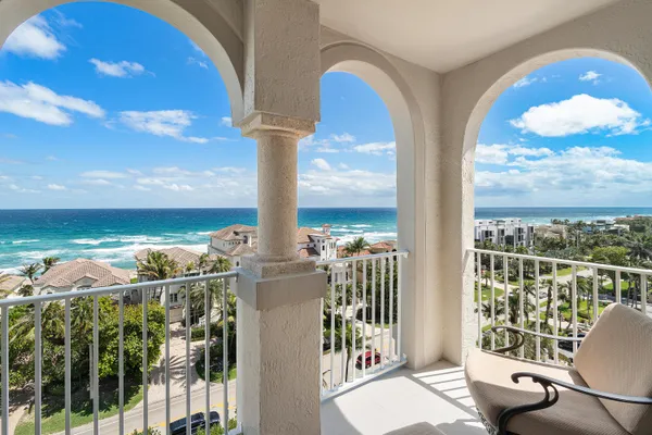 a view of a balcony with an ocean view
