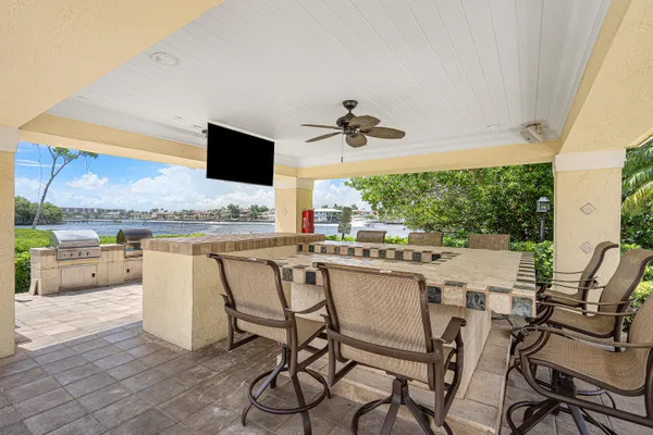 a view of a lake with couches chairs