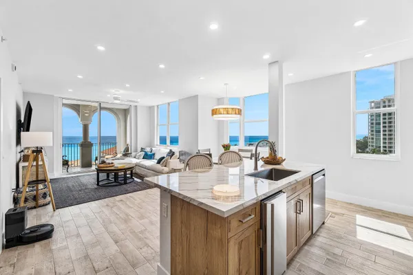 a very nice looking living room with a dining table chairs