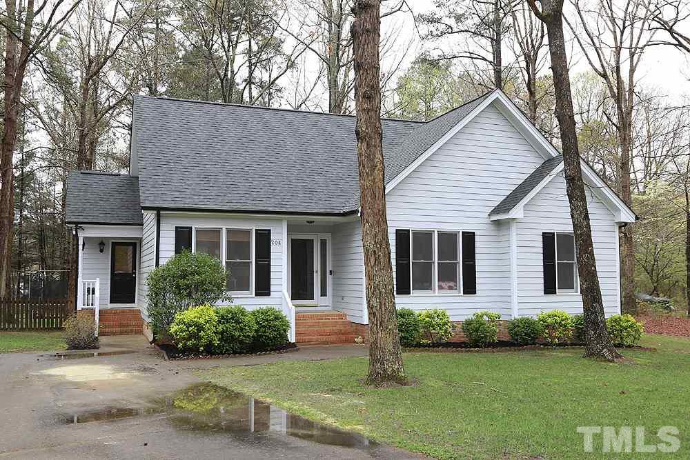 This home sits on a beautiful, wooded .78 acre homesite.  A long driveway leads to the newly painted home with new gutters and new roof (3/2020).
