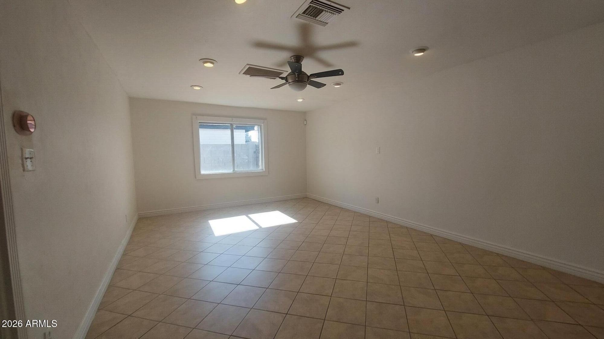 2448 West Freeway Lane Phoenix, AZ 85021 - Photo 6 of 27 a view of an empty room with a window