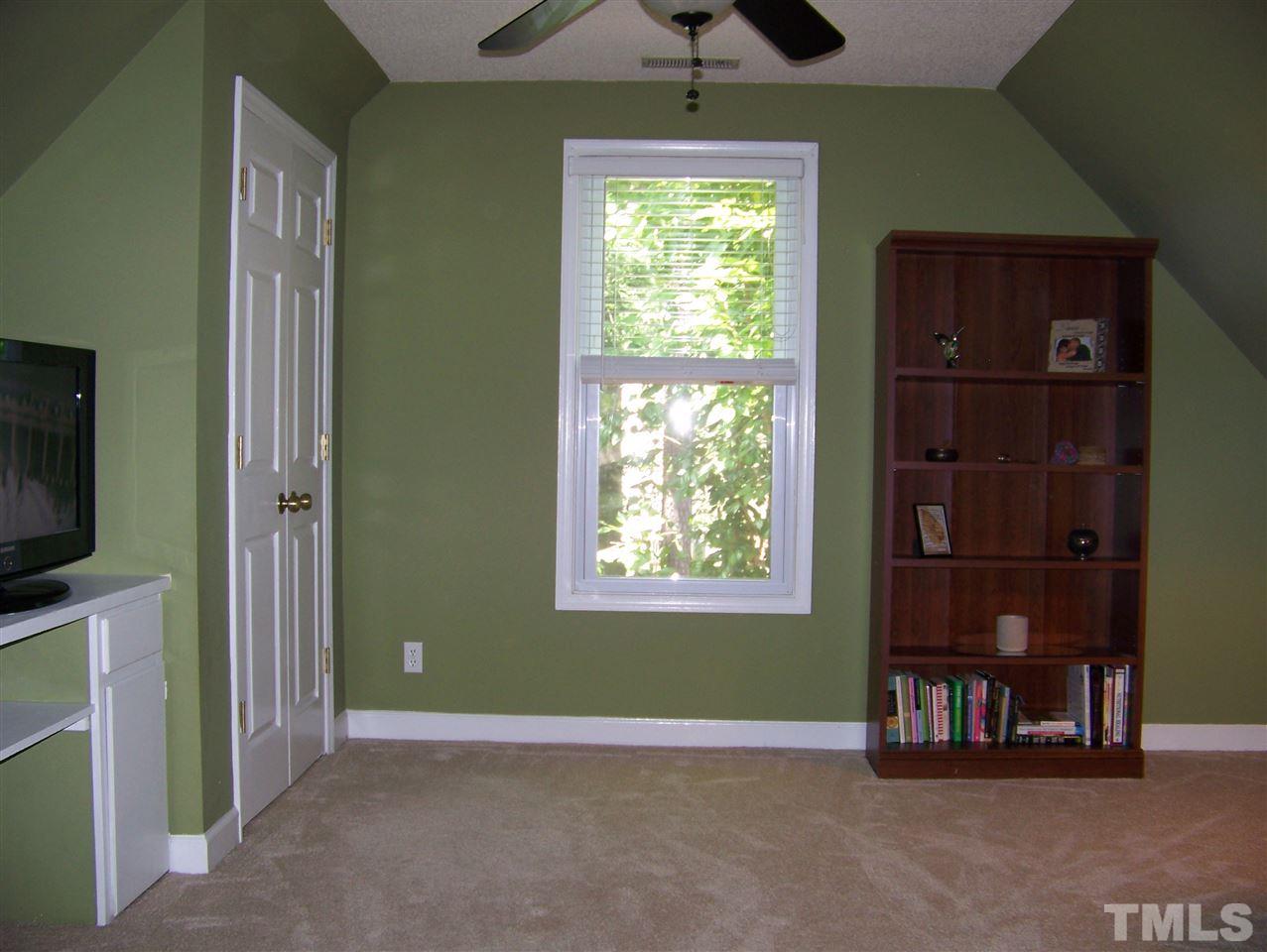 2809 Halfhitch Trail Raleigh, NC 27615 - Photo 8 of 17 THIS ROOM HAS LOTS OF POSSIBILITIES. SELLERS USE AS A SITTING/BONUS ROOM W/TV. COULD BE AN OFFICE, NURSERY, WORKOUT AREA, MORE STORAGE....NEW OWNER GETS TO DECIDE!