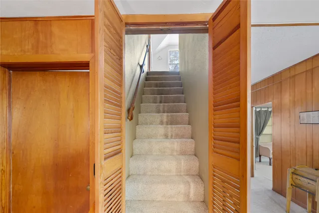 a bedroom with furniture and a chandelier